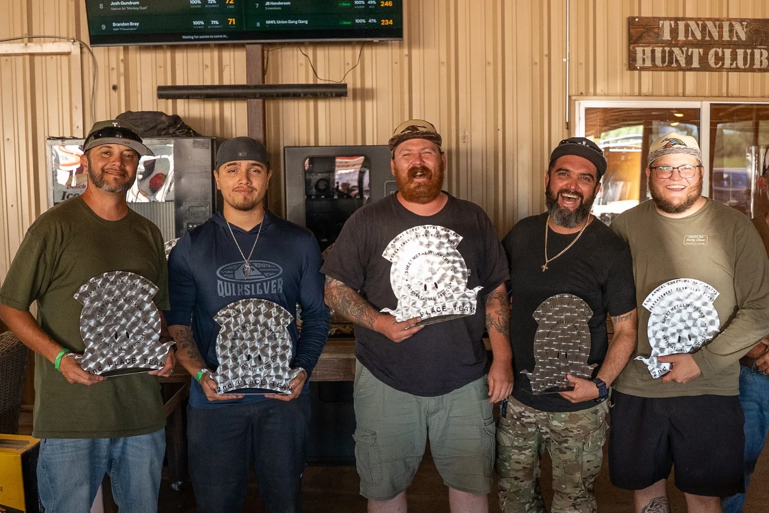 The second-place team poses with trophies at Tinnin Hunt Club.